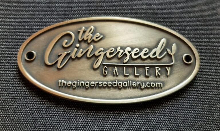 Gingerseed custom Oval embossed badge antique brass brassname